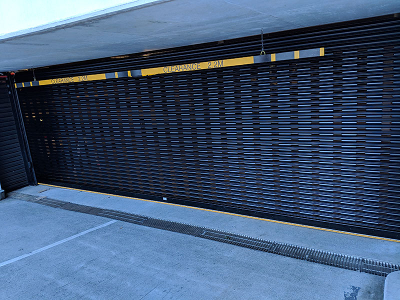 Steel security shutter at a car park entry